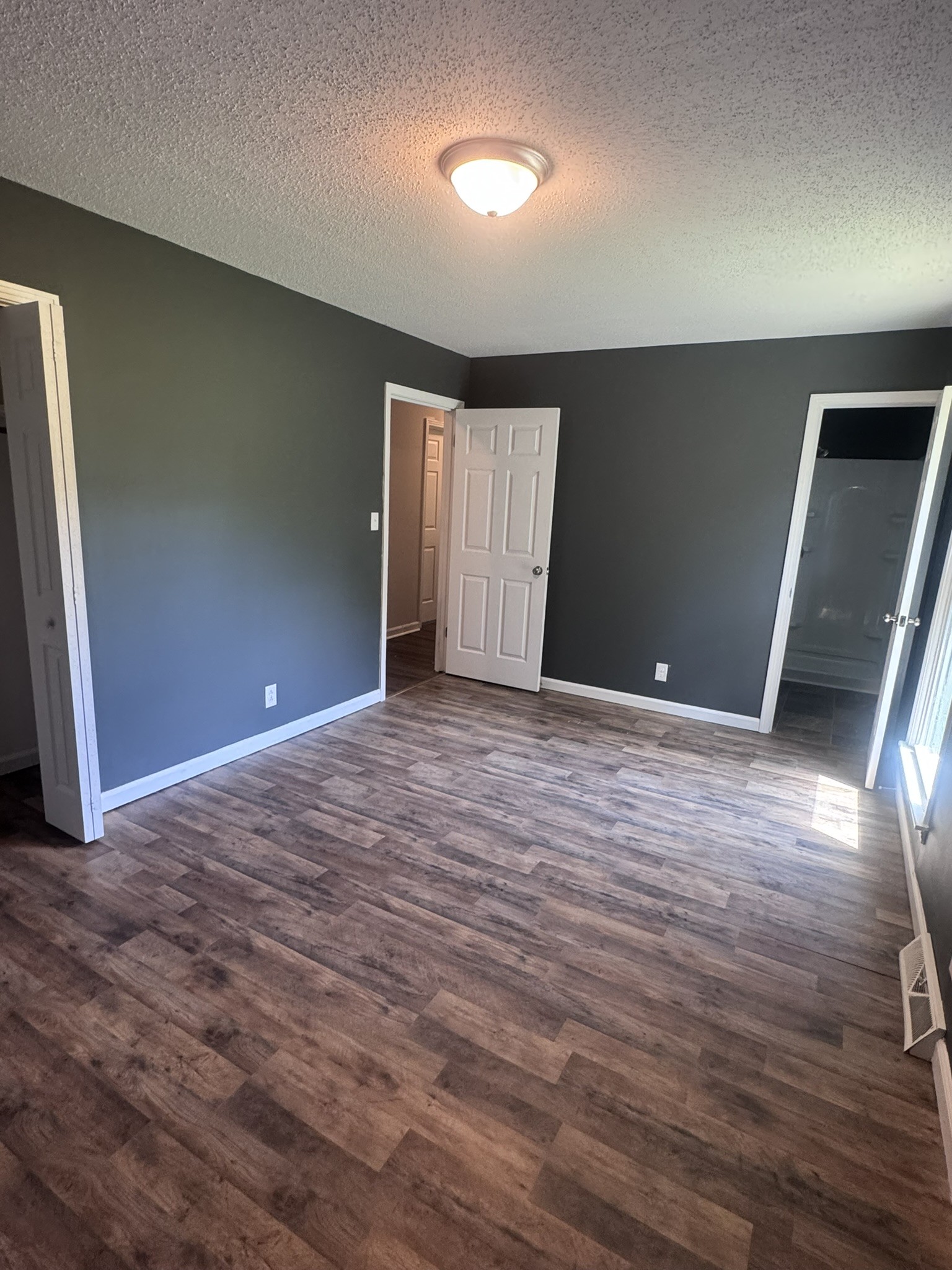 236 Raintree Drive Clarksville, TN 37042 - Photo 6 of 19 a view of an empty room with wooden floor