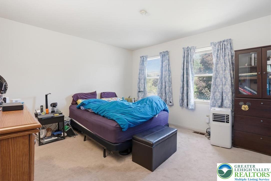 808 Hunter Road Easton, PA 18040 - Photo 23 of 41 Natural illumination streams into this carpeted oversized master bedroom, offering views of the backyard