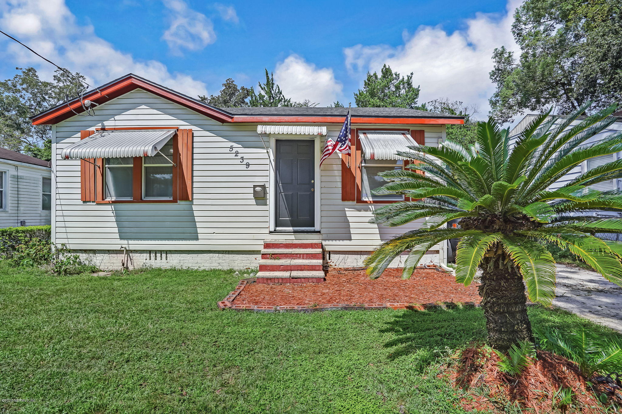 5239 Sunderland Road Jacksonville, FL 32210 - Photo 1 of 40 front view of a house with a yard