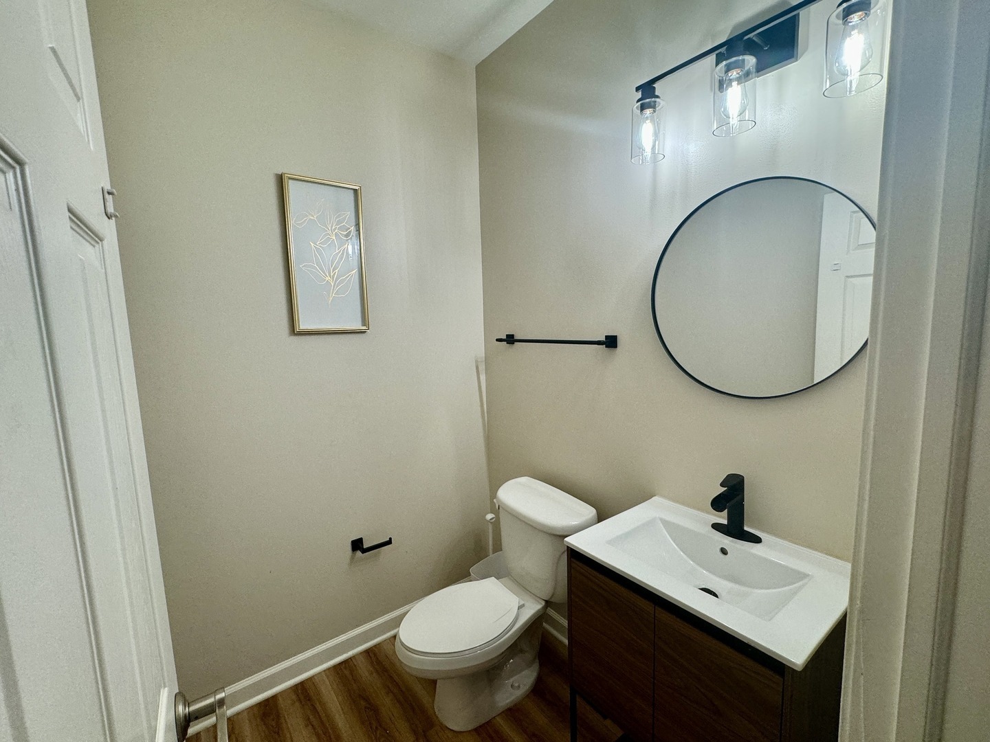 423 Acushnet Street, Unit 423 Elgin, IL 60124 - Photo 8 of 15 a bathroom with a toilet a sink and a mirror