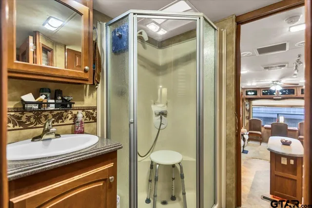 a white toilet sitting next to a bathroom sink