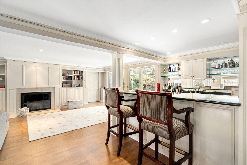 20 Windsor Road Needham, MA 02492 - Photo 13 of 29 a dining hall with stainless steel appliances granite countertop a dining table and chairs with the kitchen view
