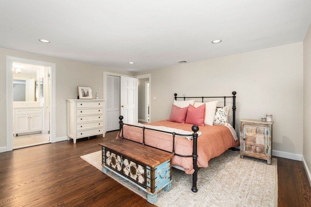 20 Windsor Road Needham, MA 02492 - Photo 20 of 29 a spacious bedroom with a bed and wooden floor