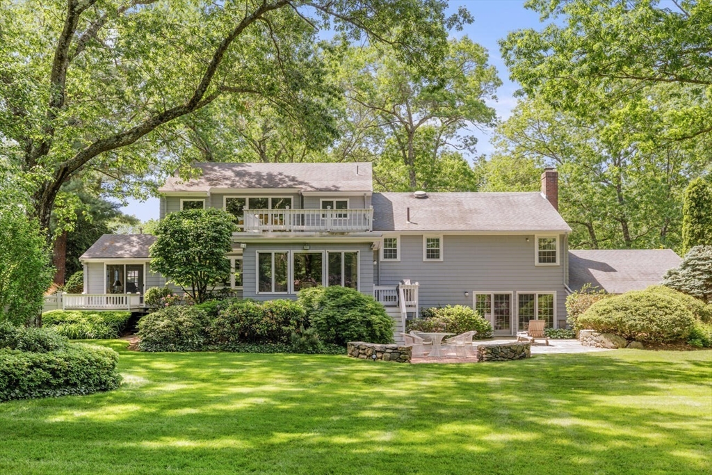 20 Windsor Road Needham, MA 02492 - Photo 26 of 29 a front view of a house with a garden and trees