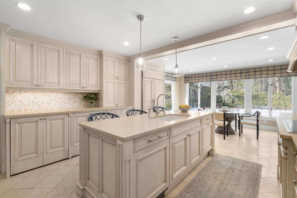 20 Windsor Road Needham, MA 02492 - Photo 7 of 29 a kitchen with a sink stove and cabinets