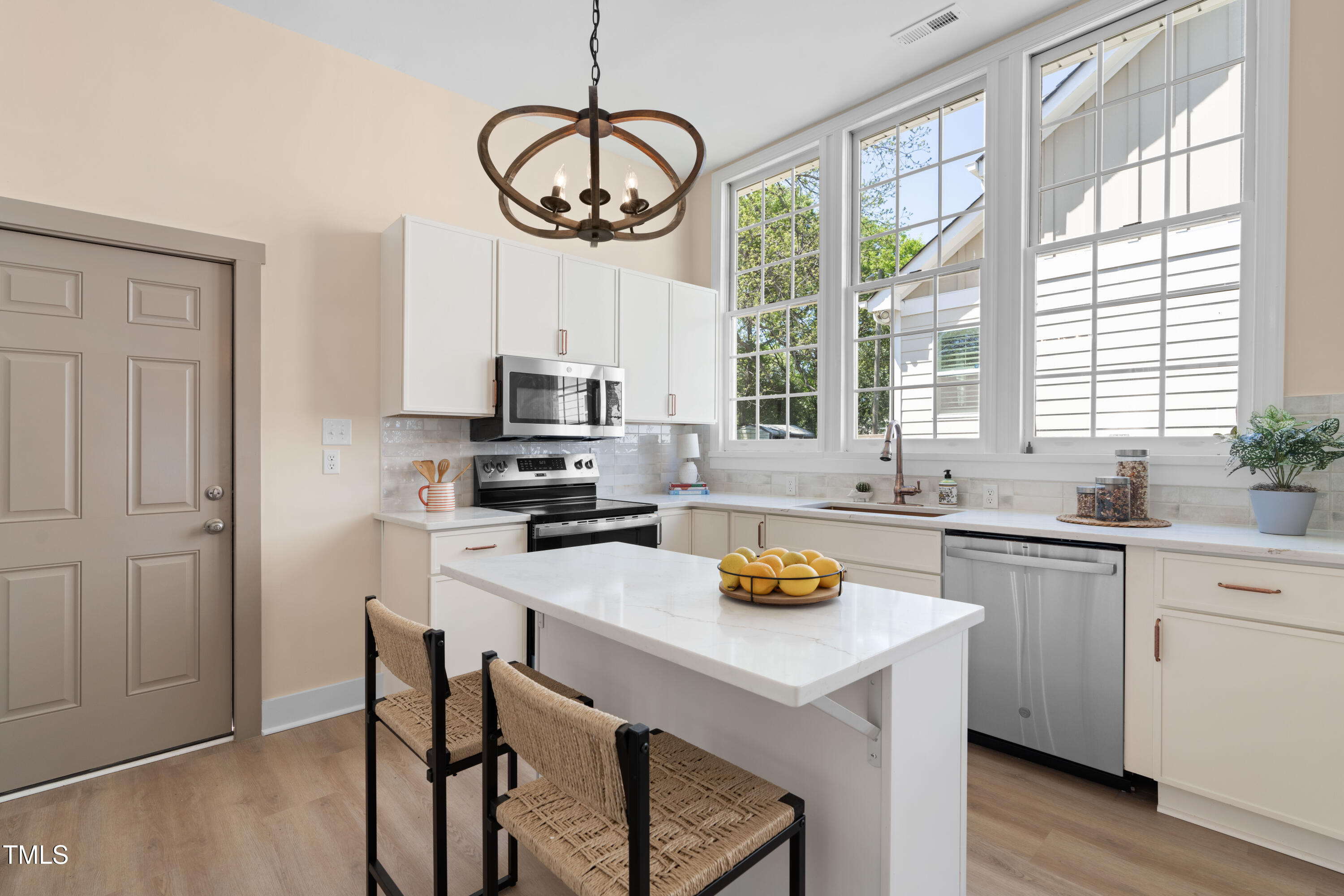 314 Bledsoe Avenue Raleigh, NC 27601 - Photo 10 of 21 a kitchen with a center island appliances and cabinets