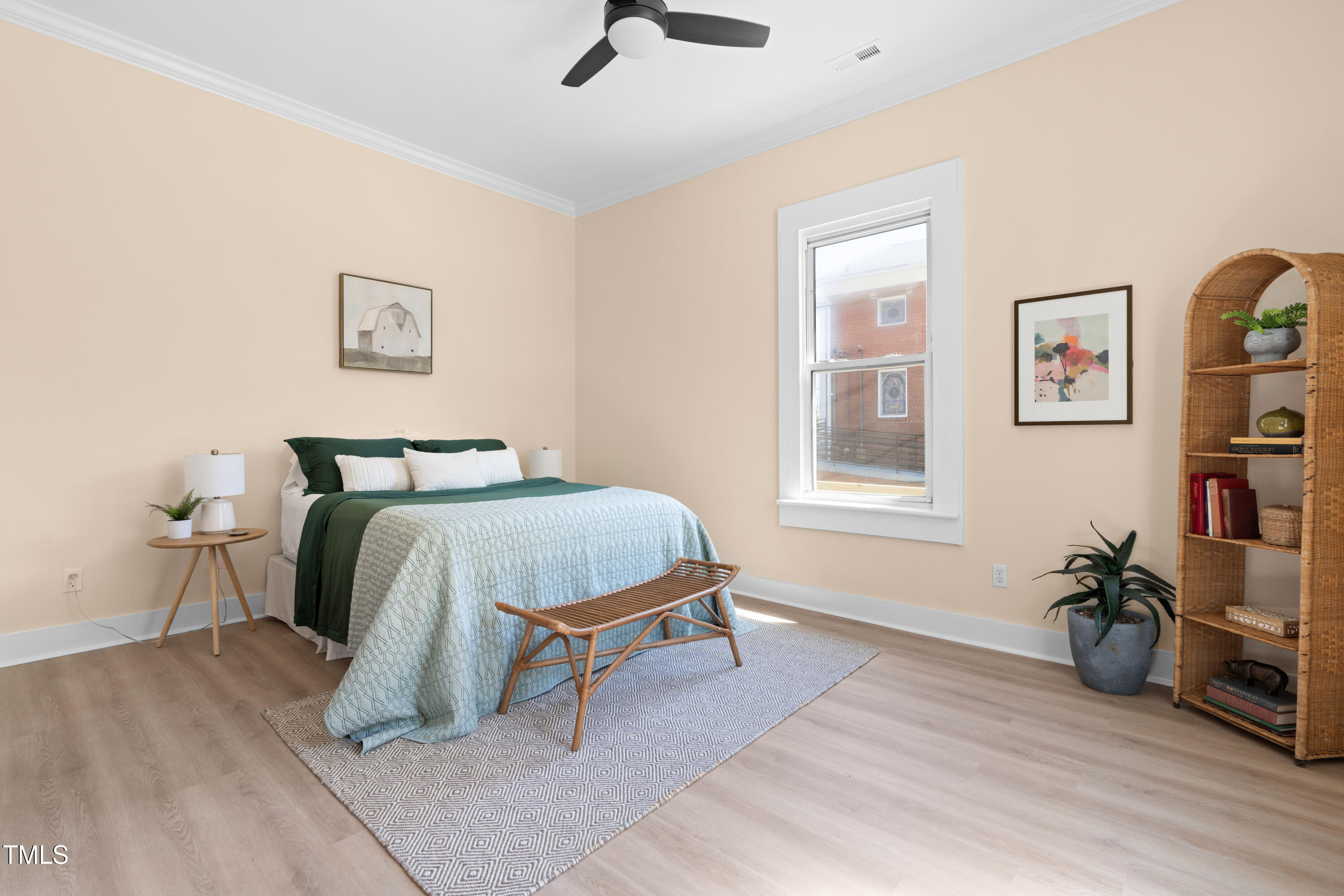 314 Bledsoe Avenue Raleigh, NC 27601 - Photo 13 of 21 a bedroom with a bed and wooden floor