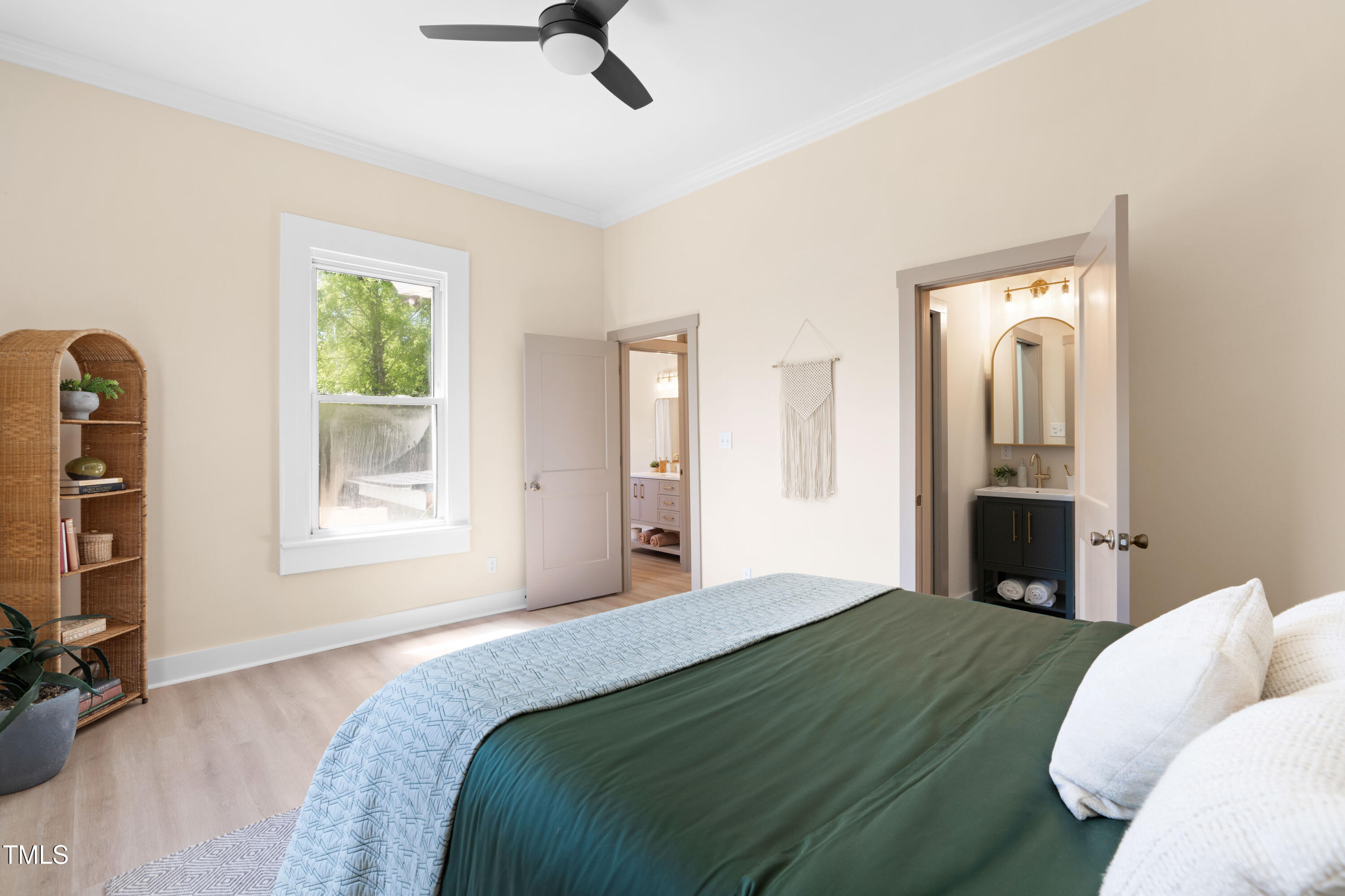 314 Bledsoe Avenue Raleigh, NC 27601 - Photo 14 of 21 a bedroom with a bed and a television
