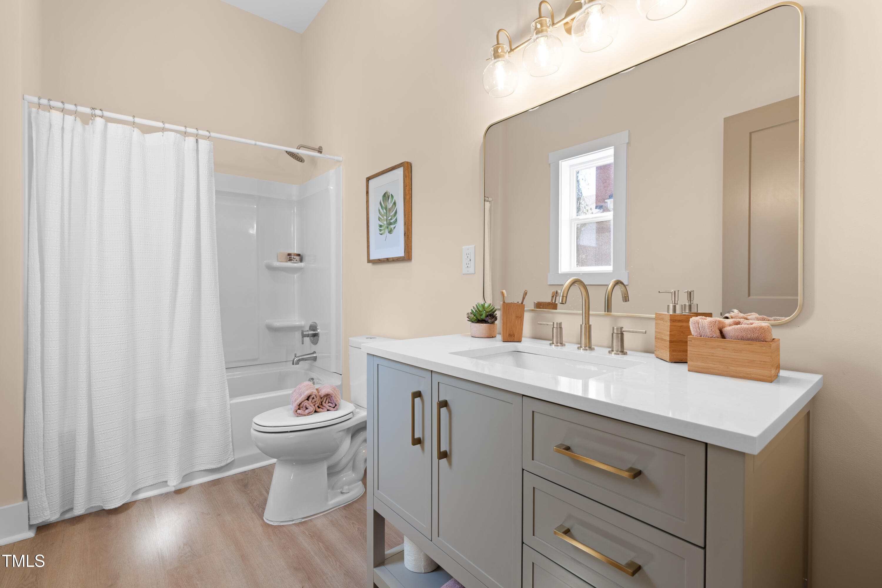314 Bledsoe Avenue Raleigh, NC 27601 - Photo 16 of 21 a bathroom with a double vanity sink toilet and a mirror