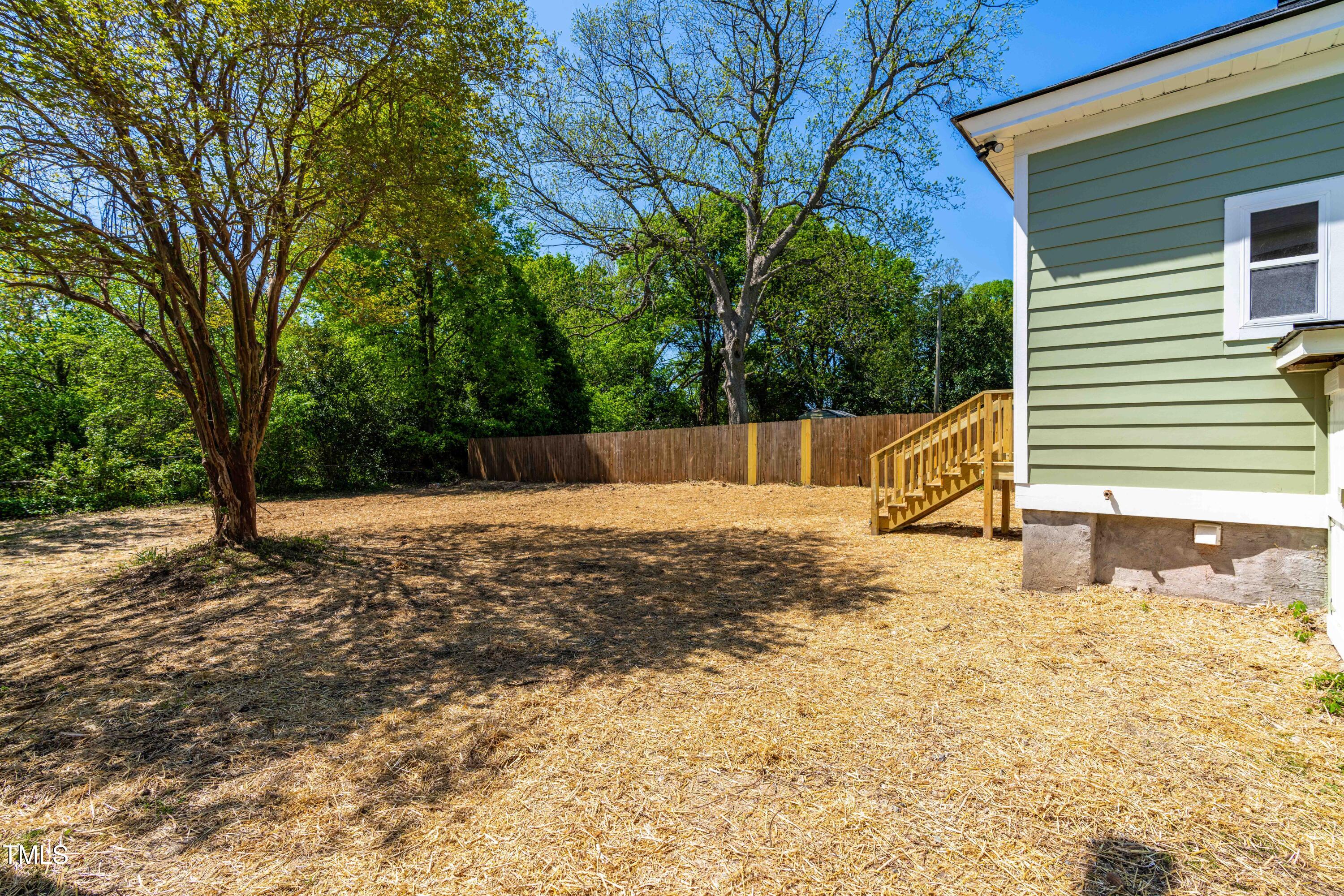 314 Bledsoe Avenue Raleigh, NC 27601 - Photo 18 of 21 a view of a backyard with large tree