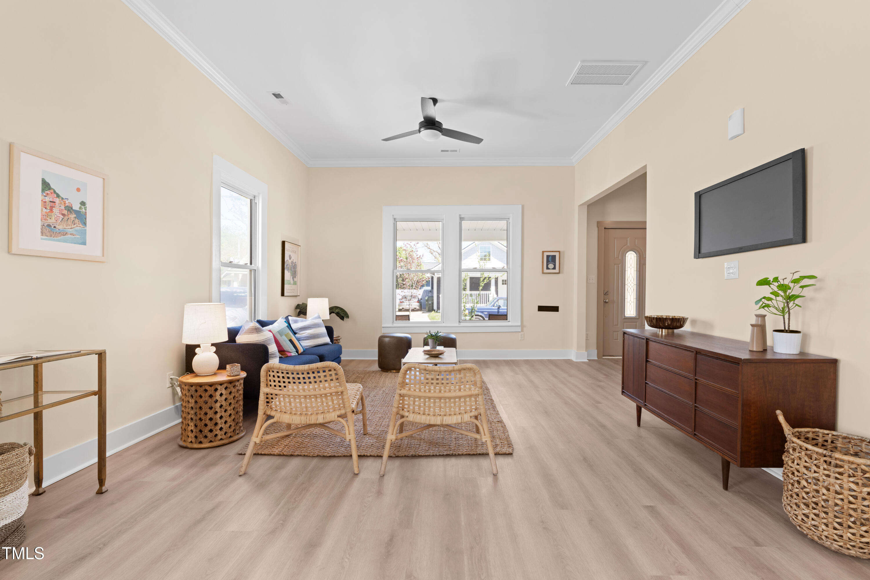 314 Bledsoe Avenue Raleigh, NC 27601 - Photo 4 of 21 a living room with furniture a flat screen tv and a large window