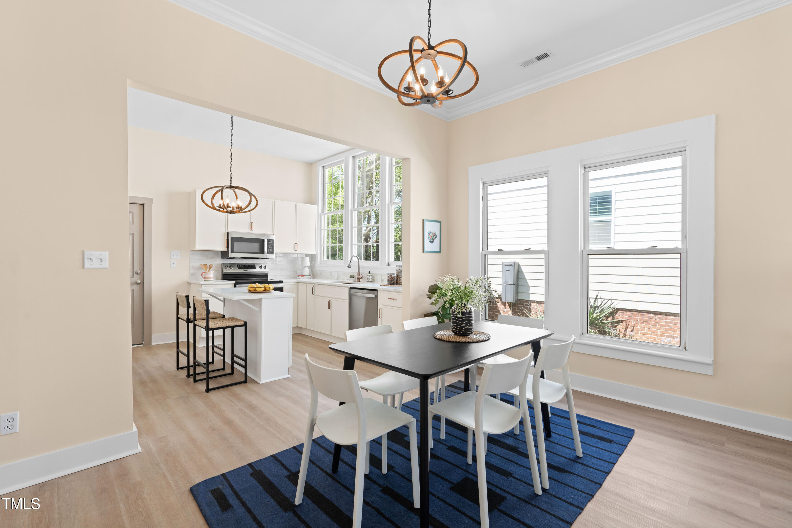 314 Bledsoe Avenue Raleigh, NC 27601 - Photo 8 of 21 a view of a dining room with furniture window and wooden floor