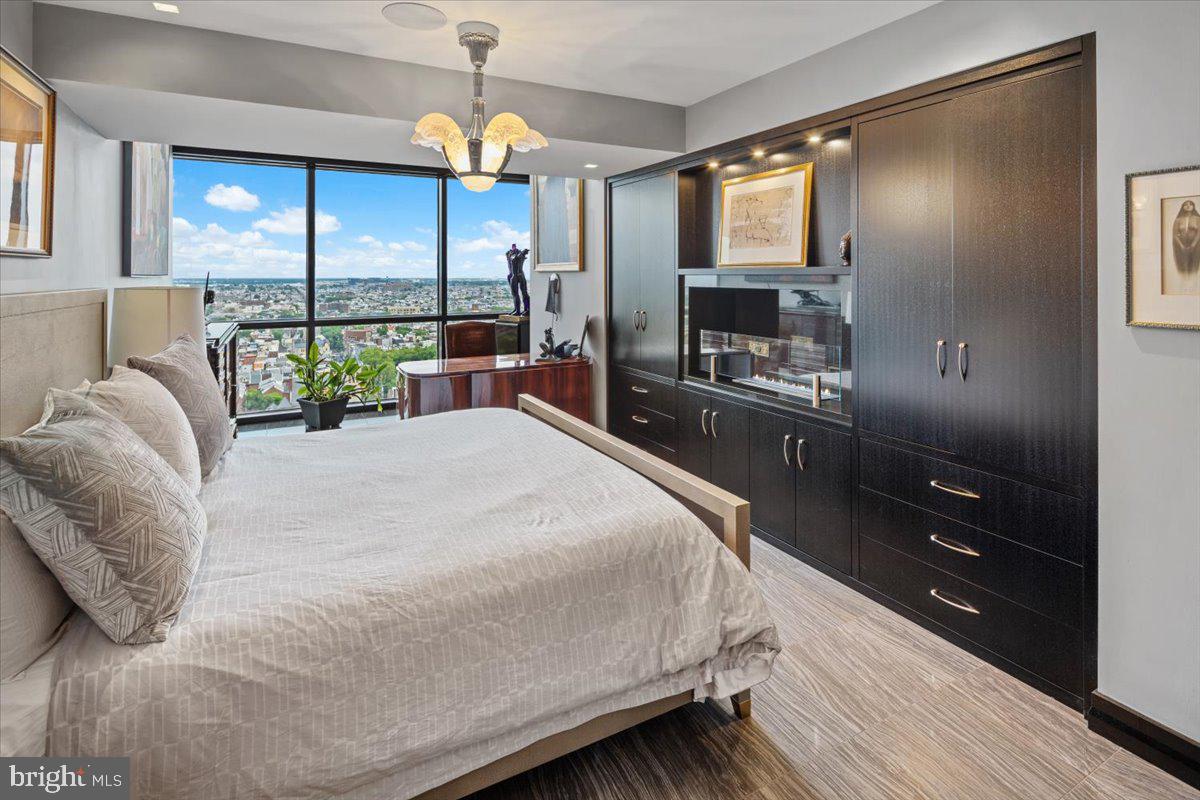 241 South 6th Street, Unit PH2505/2406 Philadelphia, PA 19106 - Photo 31 of 41 Primary Suite with Gas Fireplace