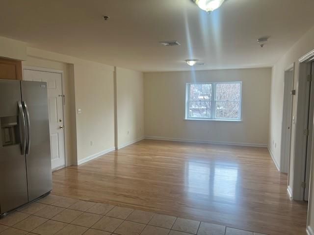 1031 Clinton Street, Unit 5B Hoboken, NJ 07030 - Photo 4 of 17 a view of an empty room with a window