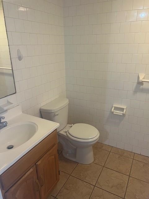 1031 Clinton Street, Unit 5B Hoboken, NJ 07030 - Photo 5 of 17 a bathroom with a toilet sink and mirror