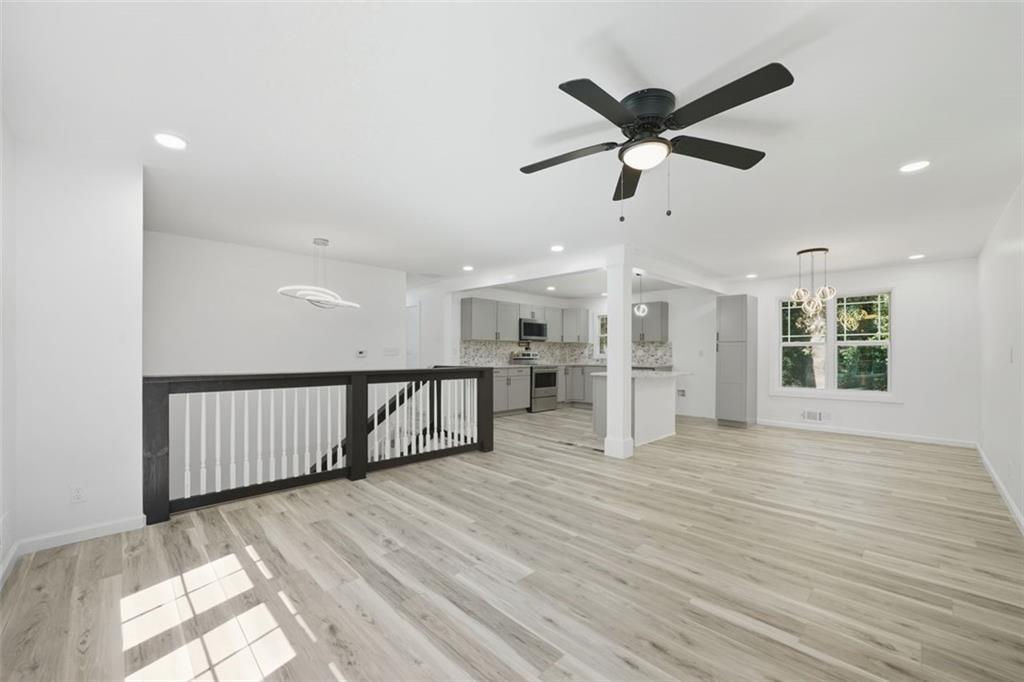 3920 Wedgefield Circle Decatur, GA 30035 - Photo 5 of 23 a view of empty room with wooden floor and ceiling fan