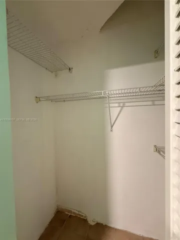 a view of a room with racks on the wall