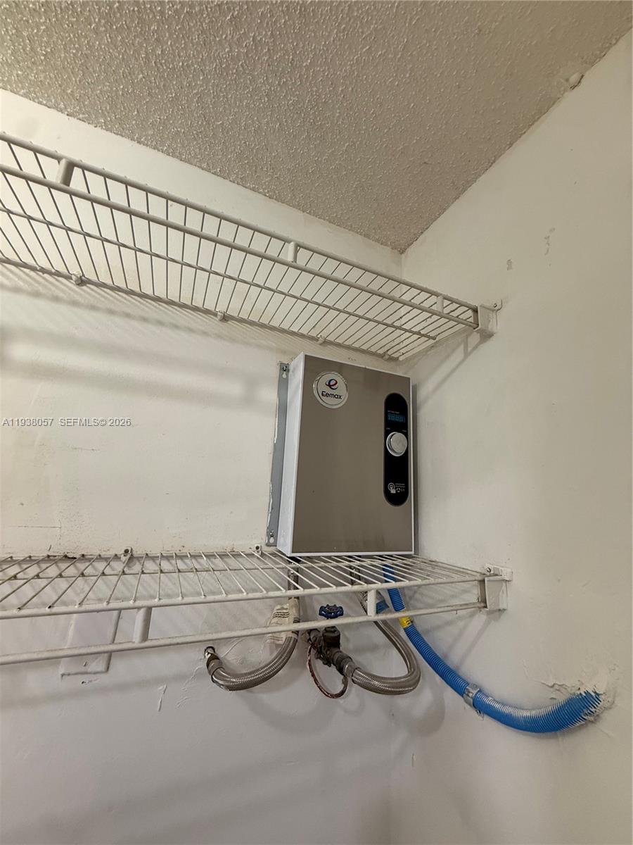 19926 Northwest 67th Place Hialeah, FL 33015 - Photo 24 of 35 Tankless water heater