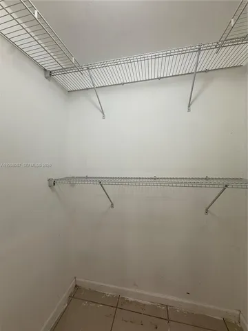 a view of a room with racks on the wall