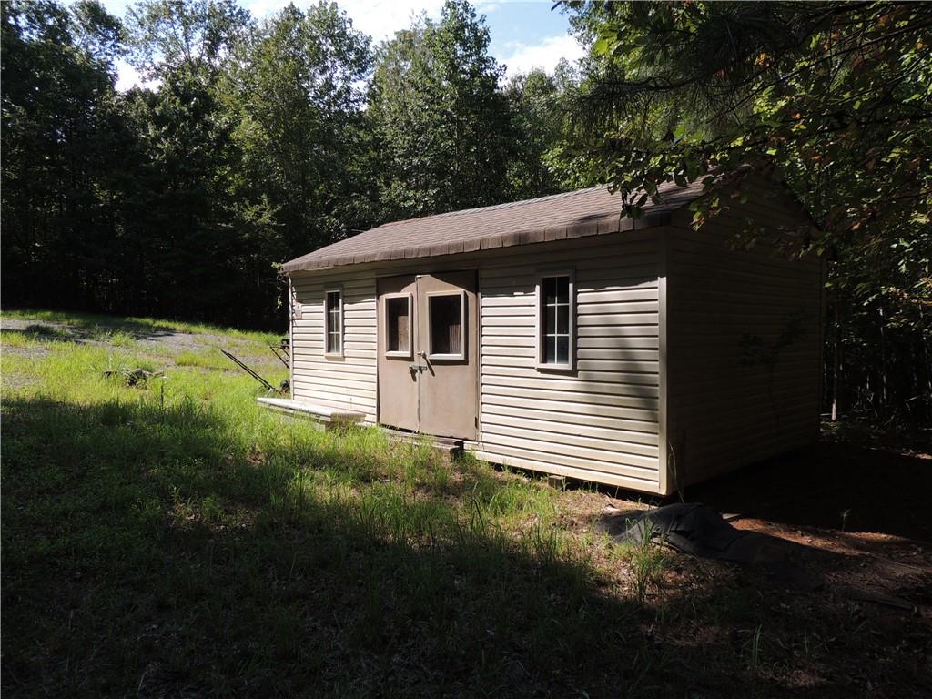 0 Indian Knoll Road Cumming, GA 30041 - Photo 11 of 37 a front view of a house with a yard