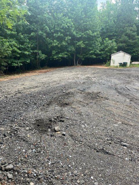 0 Indian Knoll Road Cumming, GA 30041 - Photo 10 of 37 a view of a dry yard with trees