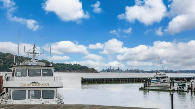 a view of house with lake view and boat