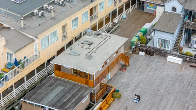 an aerial view of a building with street