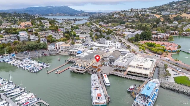 an aerial view of a house with a lake view