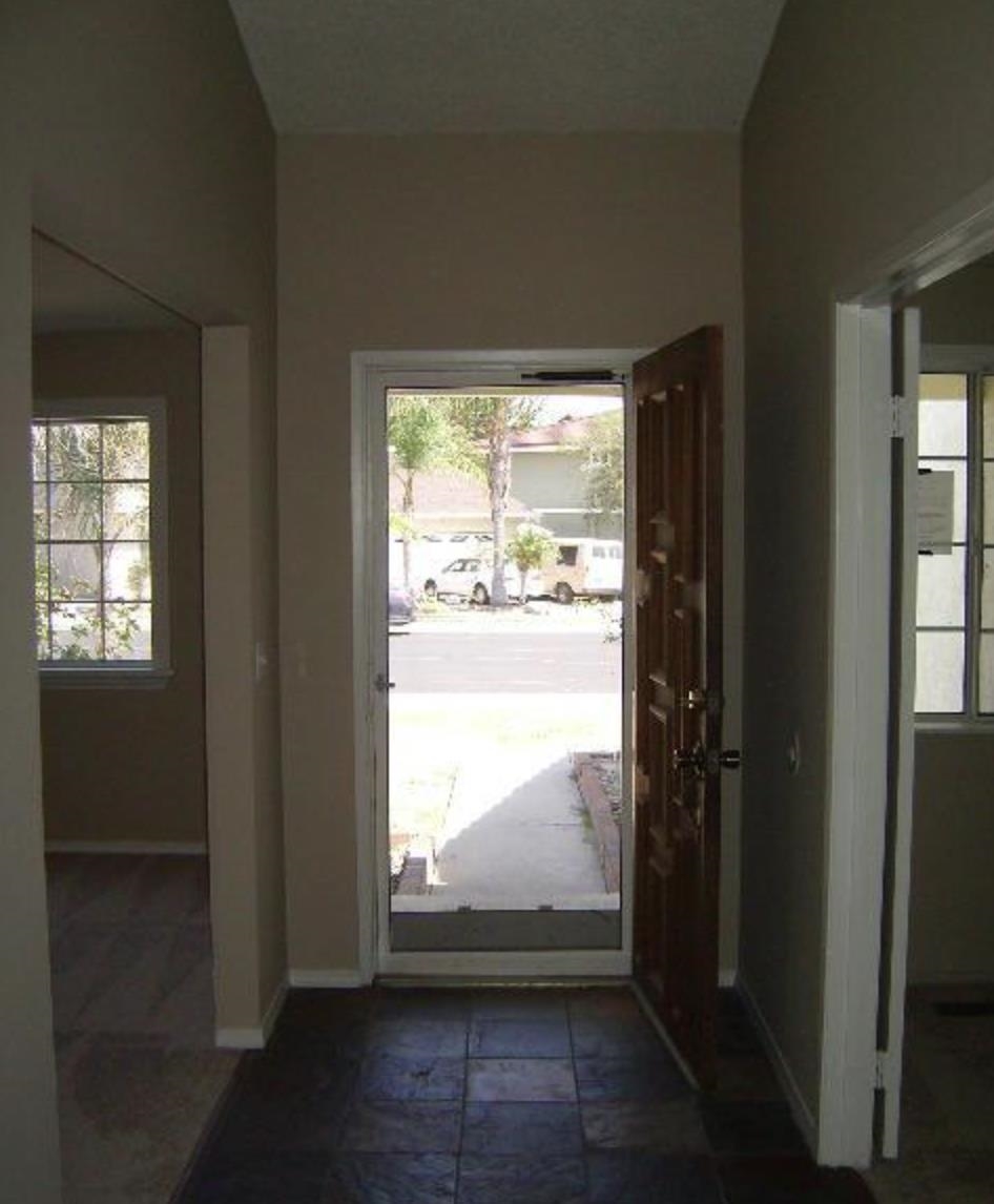 5250 Riverlake Road Discovery Bay, CA 94505 - Photo 14 of 18 Entrance foyer featuring baseboards and dark stone finish floors