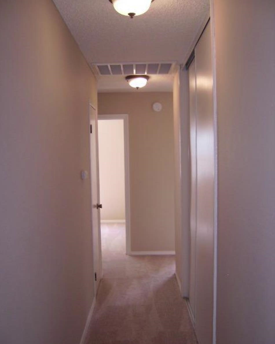 5250 Riverlake Road Discovery Bay, CA 94505 - Photo 15 of 18 Hallway featuring light carpet and a textured ceiling
