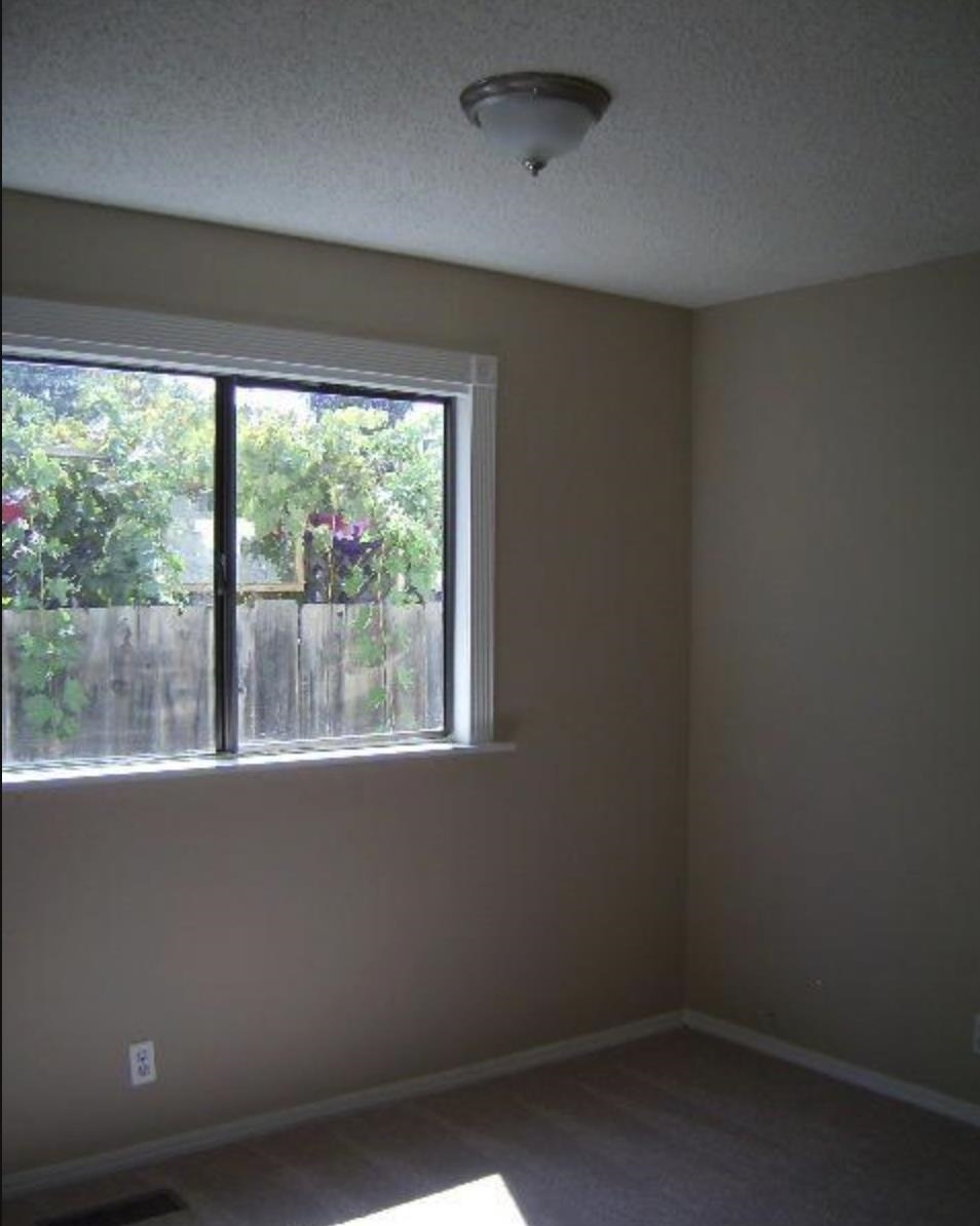 5250 Riverlake Road Discovery Bay, CA 94505 - Photo 17 of 18 Unfurnished room with a textured ceiling and dark carpet