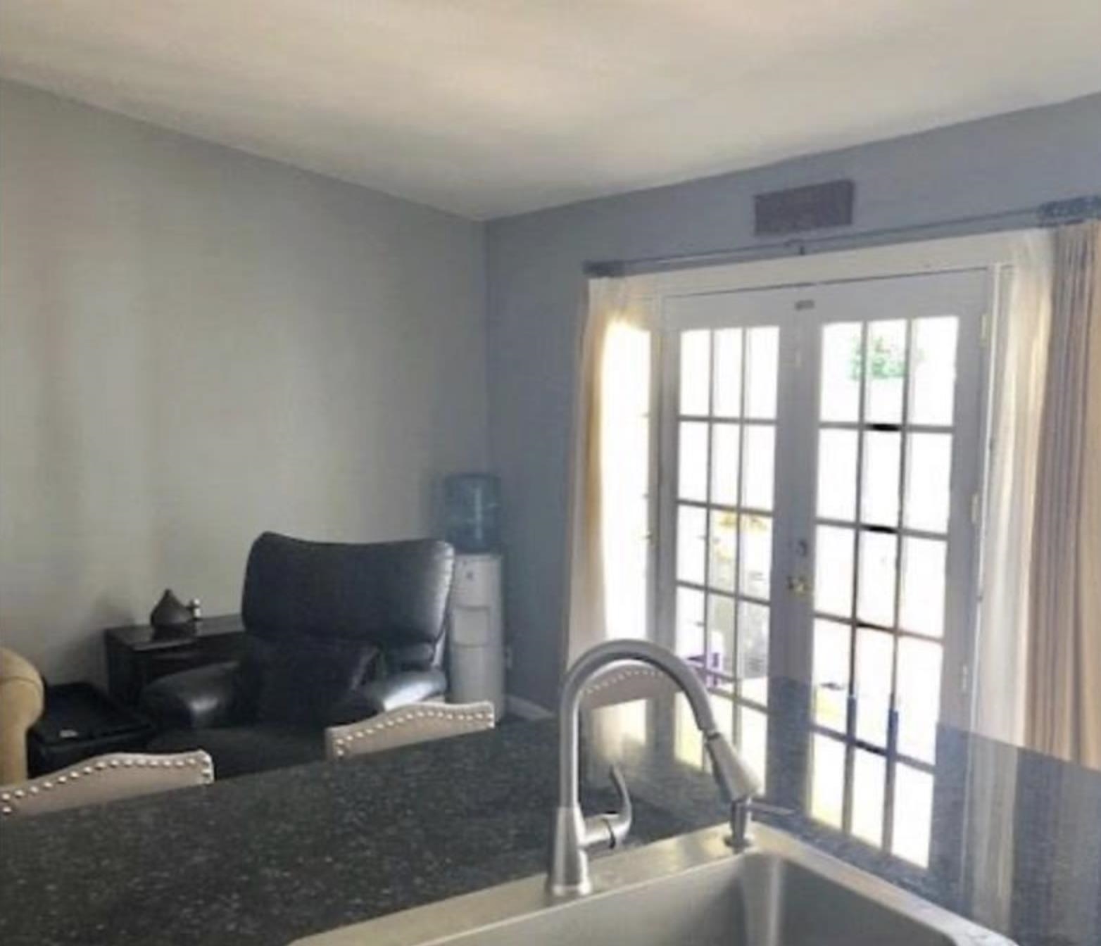 5250 Riverlake Road Discovery Bay, CA 94505 - Photo 7 of 18 Kitchen with french doors and dark stone counters