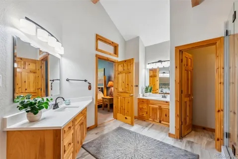 a room that has a bed and a table in it