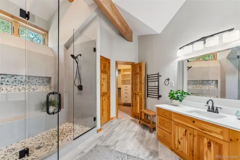 a spacious bathroom with a double vanity sink shower and a mirror