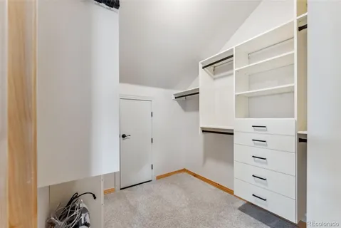 a view of an empty walk in closet