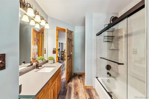 a view of a hallway with windows and stairs