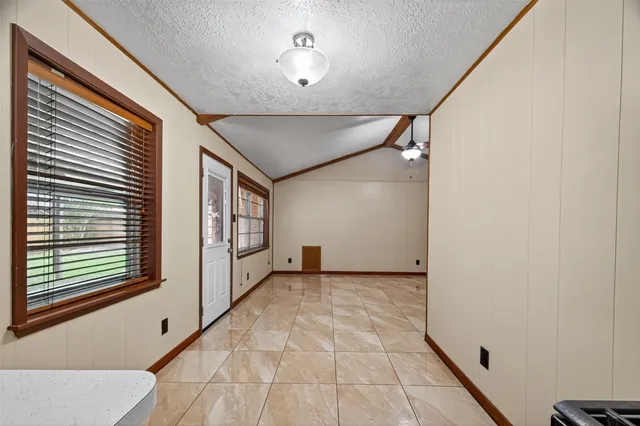 a view of empty room with windows