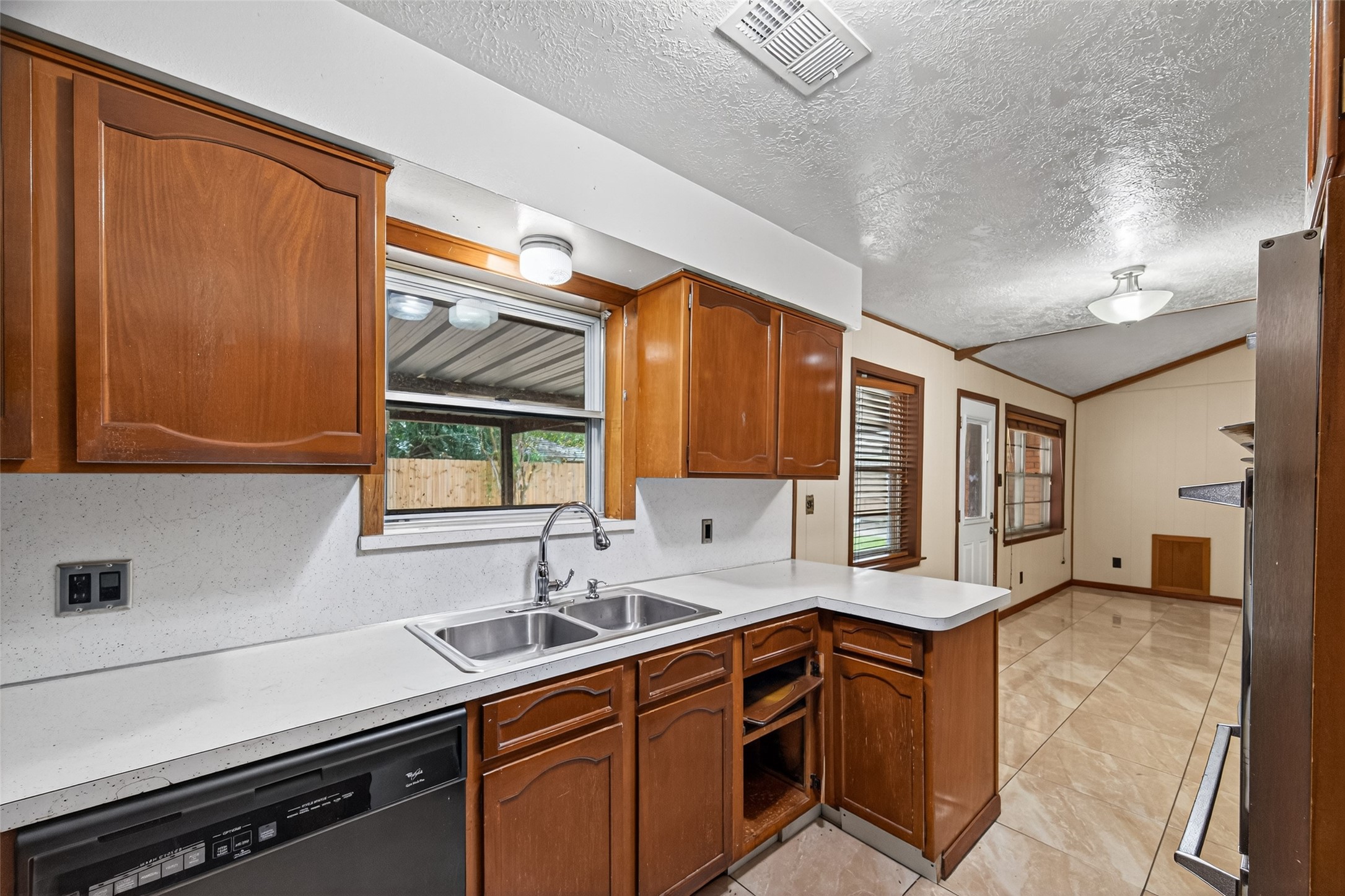 2609 Raspberry Lane Pasadena, TX 77502 - Photo 20 of 40 a kitchen with a sink appliances cabinets and a window