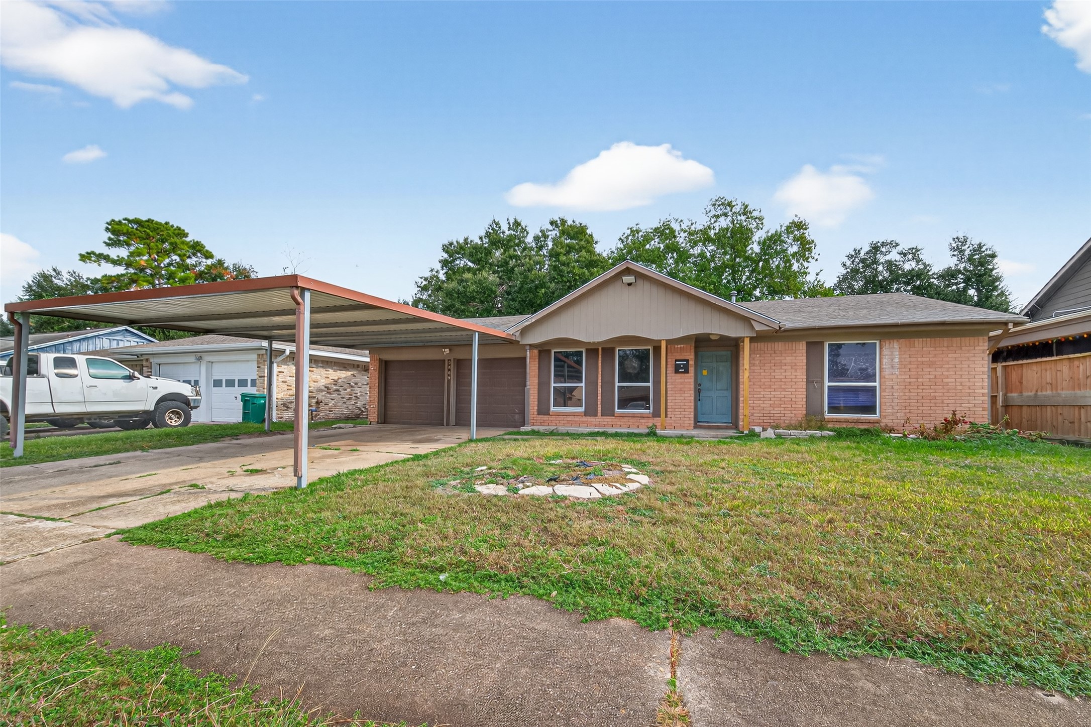2609 Raspberry Lane Pasadena, TX 77502 - Photo 3 of 40 a front view of a house with garden