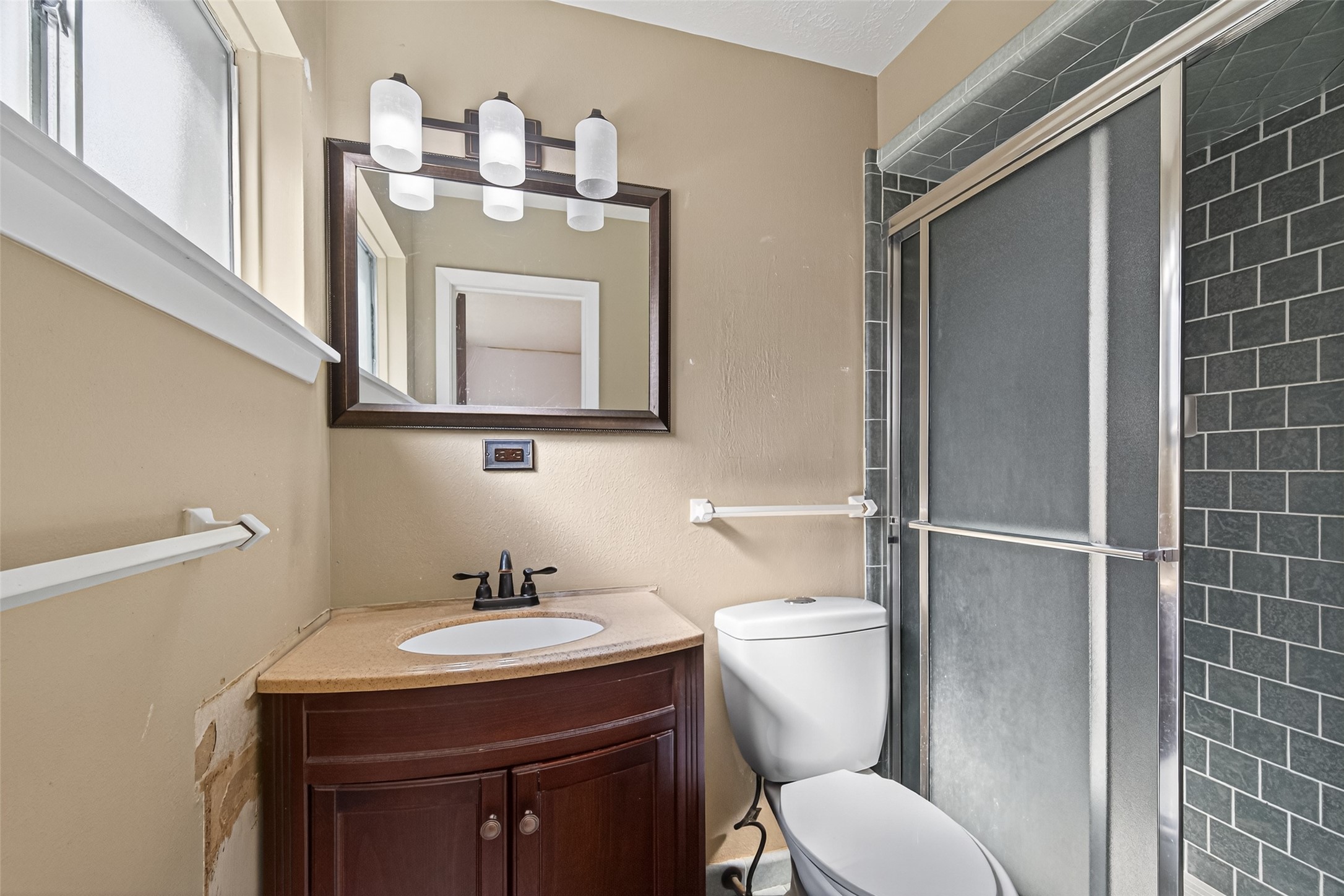 2609 Raspberry Lane Pasadena, TX 77502 - Photo 36 of 40 a bathroom with a toilet sink and mirror