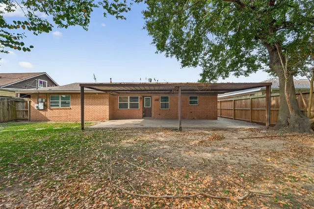 front view of a house with a garden