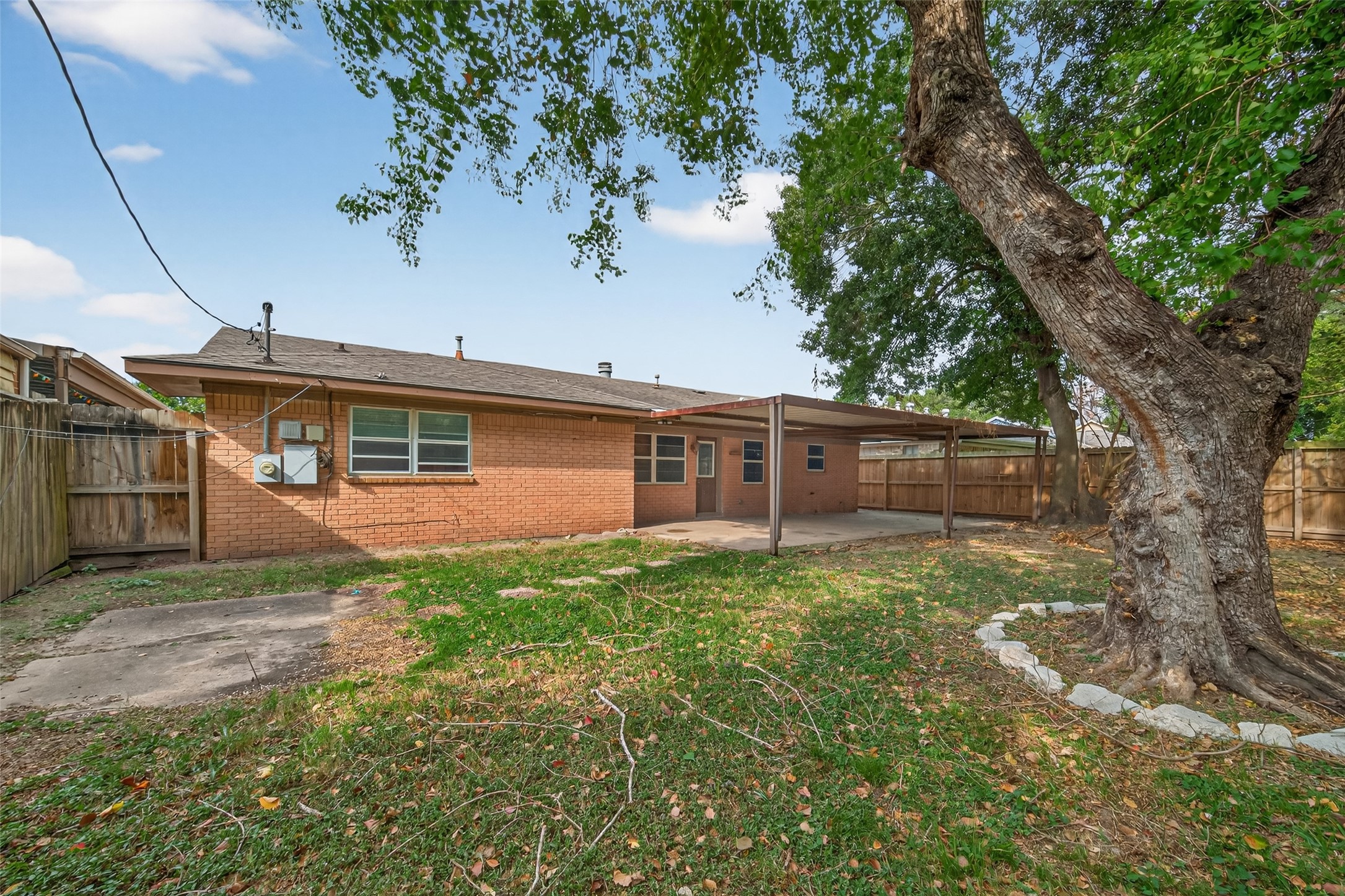 2609 Raspberry Lane Pasadena, TX 77502 - Photo 39 of 40 a view of a yard in front of a house with large tree