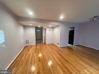 9218 Sprucewood Road Burke, VA 22015 - Photo 11 of 33 Spacious room with warm wooden floors.