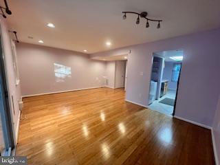 9218 Sprucewood Road Burke, VA 22015 - Photo 13 of 33 Spacious, sunlit room with elegant flooring.