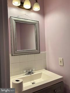 9218 Sprucewood Road Burke, VA 22015 - Photo 19 of 33 Charming powder room with elegant accents.