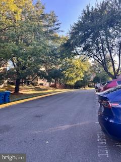 9218 Sprucewood Road Burke, VA 22015 - Photo 21 of 33 Tranquil tree-lined street in autumn.