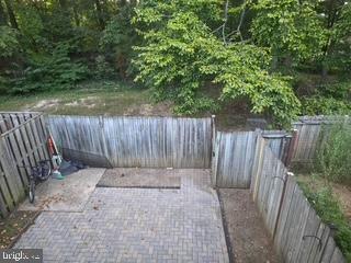 9218 Sprucewood Road Burke, VA 22015 - Photo 32 of 33 Serene backyard retreat with lush greenery.