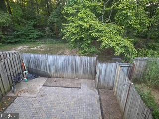 9218 Sprucewood Road Burke, VA 22015 - Photo 33 of 33 Serene backyard retreat with natural greenery.