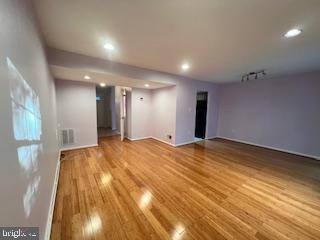 9218 Sprucewood Road Burke, VA 22015 - Photo 7 of 33 Spacious room with warm wooden floors.