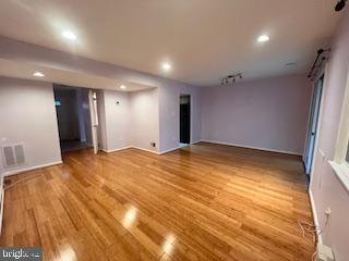 9218 Sprucewood Road Burke, VA 22015 - Photo 8 of 33 Spacious, light-filled room with hardwood floors.